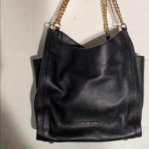 Michael Kors purse in EUC black gold chains clean